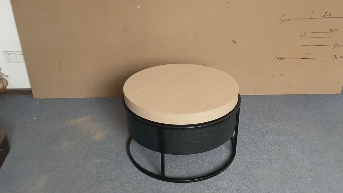 Ronde salontafel met opbergruimte: het blad draait aan twee kanten opzij en geeft het opbergvak vrij